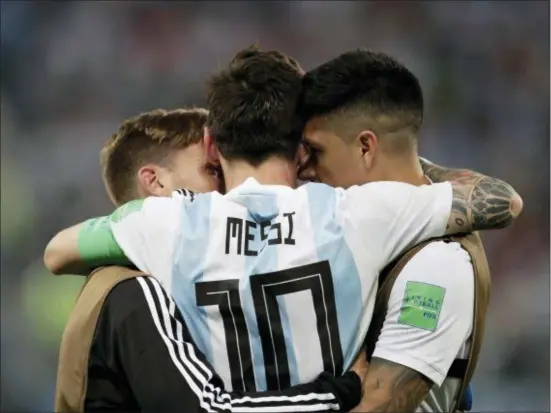  ?? DMITRI LOVETSKY — THE ASSOCIATED PRESS ?? Argentina’s Lionel Messi react with his teammates during the group D match between Argentina and Nigeria at the 2018 soccer World Cup in the St. Petersburg Stadium in St. Petersburg, Russia, Tuesday.