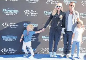  ??  ?? PULLED APART: Singer and songwriter Gwen Stefani with ex-husband Gavin Rossdale and two of their children. Rossdale had an affair with the children’s babysitter.