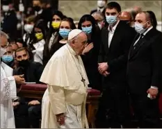  ?? Alessandra Tarantino / Associated Press ?? Pope Francis passes Melitopol Mayor Ivan Fedorov, second from right, and Ukrainian lawmakers during an Easter vigil ceremony Saturday in St. Peter's Basilica at the Vatican.