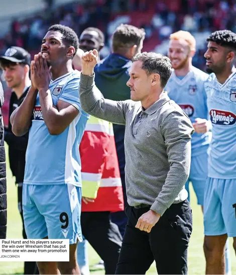  ?? JON CORKEN ?? Paul Hurst and his players savour the win over Wrexham that has put them one win away from promotion