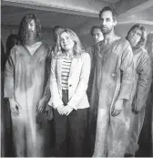  ?? CBS ?? Rose McIver, center, in the comedy series “Ghosts.”