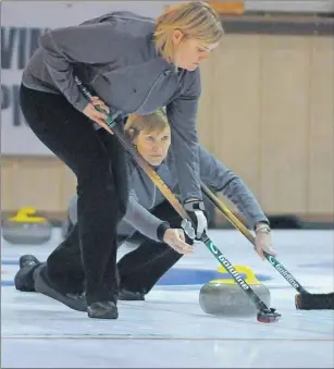  ?? JASON MALLOY/THE GUARDIAN ?? Skip Kim Dolan releases a shot as second Sinead Dolan prepares to sweep Sunday at the P.E.I. Scotties Tournament of Hearts in Montague.