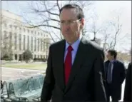  ?? AP PHOTO/JOSE LUIS MAGANA ?? In this March 22 file photo, AT&T CEO Randall Stephenson leaves the federal courthouse in Washington. Stephenson said the company made a “big mistake” in hiring President Donald Trump’s attorney Michael Cohen as a political consultant.