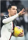  ??  ?? Cristiano Ronaldo celebrates after scoring a penalty