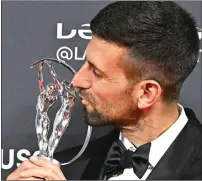  ?? — AFP ?? Serbian tennis player Novak Djokovic poses with the Laureus World Sportsman of the Year award in Madrid.