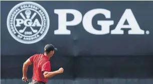  ?? JAMIE SQUIRE/GETTY IMAGES ?? Tiger Woods’ fist pumps and a barrage of birdies were welcomed by one of the noisiest crowds to watch a major championsh­ip. Woods shot 64, his lowest final round in a major.