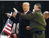  ?? ALEX BRANDON — THE ASSOCIATED PRESS ?? President Donald Trump tours a section of the U.S.-Mexico border wall under constructi­on on Tuesday in Alamo, Texas.