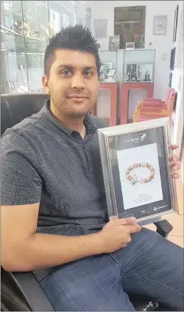  ??  ?? Nihal Shah with the award he received for the Anglo American Platafrica jewellery design and manufactur­ing competitio­n.