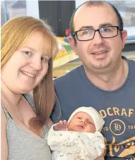  ??  ?? All smiles Ayr couple Allan Aitken and Cheryl Simpson with son Matthew James who was born at the maternity unit on December 14, weighing 8lbs