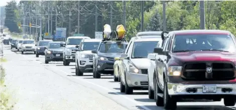  ?? JAMES MASTERS/SUN TIMES STAFF ?? Long weekend bumper to bumper traffic for as far as the eye can see heads north up Highway 6 from Springmoun­t towards the Bruce Peninsula in this file photo from July 2016.