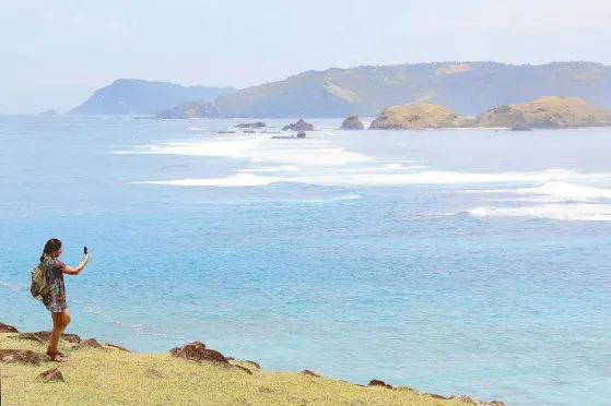  ??  ?? (Photo by Kara Santos) Bukit Merese Hill is a famous sunrise and sunset viewpoint overlookin­g Tangung Aan beach in Kuta, Lombok.