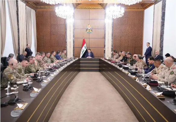  ?? Photo: Iraqi Prime Minister Media Office ?? Mohammed Shia Al Sudani presides over a meeting during talks between Iraq and the US to end the mission of the coalition in Iraq
