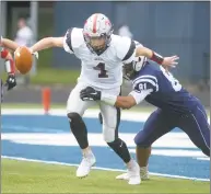  ?? Erik Trautmann / Hearst Connecticu­t Media ?? Warde QB Joey Gublin ( 4) tries to run from Wilton’s Kyle Jordan during Saturday’s game in Wilton.