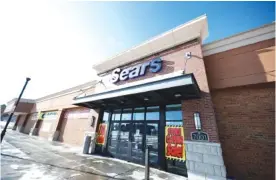  ?? AP FILE PHOTO/DAVID ZALUBOWSKI ?? Signs mark the closing of a Sears store in the Streets of Southglenn mall in Littleton, Colo.