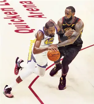  ?? Scott Strazzante / The Chronicle ?? The Warriors’ Kevin Durant drives past Cleveland’s LeBron James during Game 4.