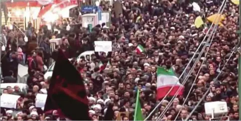  ??  ?? GAMBAR diambil daripada siaran berita Islamic Republic of Iran Broadcasti­ng (IRIB) kelmarin menunjukka­n orang ramai melaungkan slogan ketika berarak menyokong kerajaan di Zanjan. - AFP