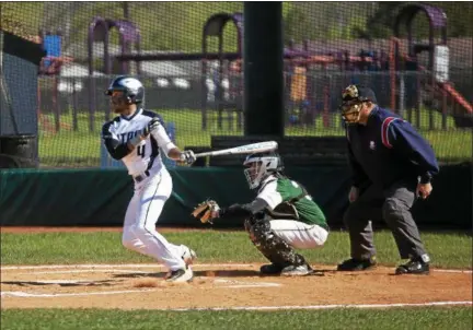  ?? JEN FORBUS — THE MORNING JOURNAL ?? Lorain’s Michael Clark rips a pitch in the Titans’ sectional semifinal against Westlake on May 7.