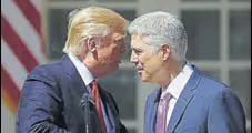  ?? AP ?? US President Donald Trump congratula­tes Neil Gorsuch who was sworn in as an associate justice of the Supreme Court.