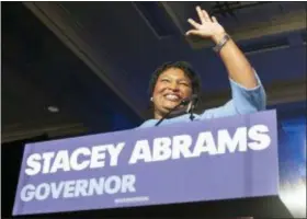  ?? AP FILE PHOTO/JOHN AMIS ?? Georgia Democratic gubernator­ial candidate Stacey Abrams speaks to supporters during an election night watch party in Atlanta.