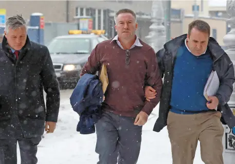  ?? Photo: Paddy Cummins/PCPhoto.ie. Below: Lynn’s wife, Clare-born nurse Bríd Murphy ?? Michael Lynn (centre) arriving at the Criminal Courts of Justice yesterday for a special sitting.