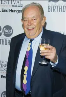  ?? PHOTO BY CHARLES SYKES — INVISION — AP, FILE ?? In this file photo, Robin Leach attends the Food Network’s 20th birthday party in New York. Leach, whose voice crystalize­d the opulent 1980s on TV’s “Lifestyles of the Rich and Famous,” died, Friday.