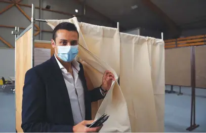  ?? Picture: AFP ?? X MARKS THE SPOT. The head of the far-right National Rally in Centre-Val de Loire, Aleksandar Nikolic, leaves the polling booth during the first round of the French regional elections yesterday.