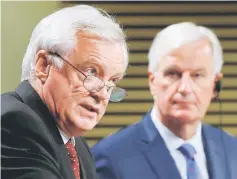  ??  ?? Davis and European Union’s chief Brexit negotiator Michel Barnier hold a joint news conference marking the end of the third formal negotiatio­n session in Brussels, Belgium.
