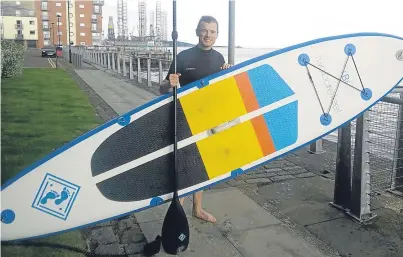  ??  ?? Arnaud Richard with his paddle board and, below, police officers at the side of the Tay at City Quay.