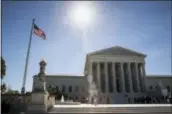  ?? J. SCOTT APPLEWHITE – ASSOCIATED PRESS ?? People visit the Supreme Court in Washington Monday as justices issued their final rulings for the term.