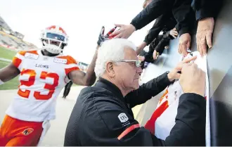  ?? PETER POWER/ THE CANADIAN PRESS ?? B.C. Lions head coach Wally Buono has been a popular figure among fans all around the CFL in his final season on the sidelines. Buono coached 10 seasons in Calgary before taking the Lions job in 2003.