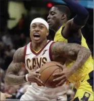 ?? TONY DEJAK — THE ASSOCIATED PRESS ?? Isaiah Thomas drives past the Pacers’ Darren Collison during the first half on Jan. 26 at Quicken Loans Arena.