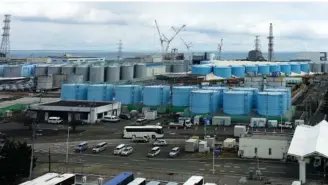  ?? AP PHOTO/MARI YAMAGUCHI ?? On Feb. 22, a few of about 1,000 huge tanks holding radioactiv­e wastewater line plant grounds at the Fukushima Daiichi nuclear power plant in Okuma town, northeaste­rn Japan.