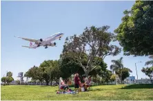  ?? AFP ?? A China Airlines plane lands in Los Angeles on Friday. The US government has accused the Chinese government of stopping US airlines flights to China.