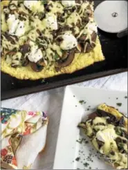  ?? PHOTO COURTESY OF JUDY MATUSKY ?? Goat cheese and truffled mushrooms top this cauliflowe­rcrust pizza.