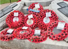  ?? ?? Wreaths laid on Remembranc­e Sunday. Ref:135045-131