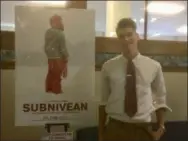  ?? ZACHARY SRNIS — THE MORNING JOURNAL ?? Jonathan Perry, 17, a junior at Sandusky Central Catholic High School, poses next to a poster of “Subnivean,” his upcoming movie.