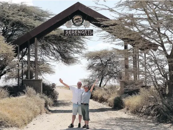  ??  ?? Ken Donohue and his wife, Carrie, at the Serengeti National Park in Tanzania. Tanzania doesn’t have mosquitoes that carry yellow fever — a vital fact for kidney transplant recipient Carrie.