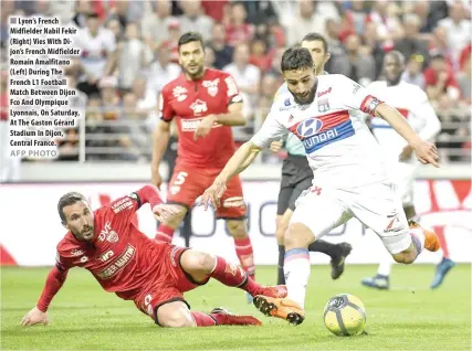  ?? AFP PHOTO ?? Lyon’s French Midfielder Nabil Fekir (Right) Vies With Dijon’s French Midfielder Romain Amalfitano (Left) During The French L1 Football Match Between Dijon Fco And Olympique Lyonnais, On Saturday, At The Gaston Gérard Stadium In Dijon, Central France....