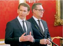  ?? AP ?? Sebastian Kurz and Heinz-Christian Strache speak after talks with Austria President Alexander van der Bellen in Vienna, Austria. —