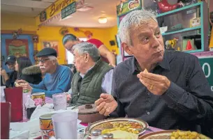 ?? JOHN TAGGART THE NEW YORK TIMES ?? Adan Medrano eats at Dona Maria Mexican Café in Houston. He is on a quest to tell the world about Texas Mexican, the cooking of South Texas and northern Mexico that predates the border.