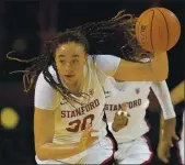  ?? JEFF CHIU – THE ASSOCIATED PRESS ?? Stanford guard Haley Jones, a Santa Cruz resident, dribbles against USC in a Pac-12 Conference game in Santa Cruz on Sunday. Santa Clara County on Tuesday cleared college athletic programs to return to campus to continue practicing and playing games during the pandemic.