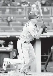  ?? ELSA/GETTY IMAGES ?? J.T. Realmuto drives in two with this hit in the first against the New York Yankees on Tuesday. inning