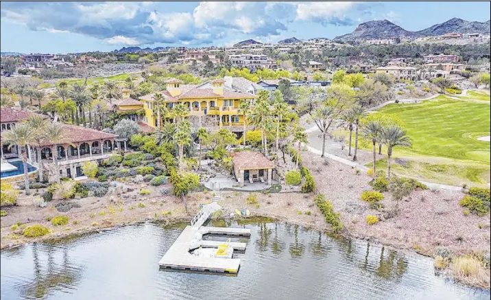  ??  ?? This 10,549-square-foot Mediterran­ean-style mansion at Lake Las Vegas has been listed $7.95 million.
Elite Homes