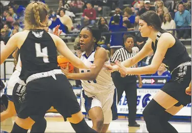  ?? Siandhara Bonnet/News-Times ?? Driving: In this file photo, Parkers Chapel’s Jazmyne Malone drives to the basket during a game against Woodlawn during the 2019-20 season. Parkers Chapel hosts Spring Hill in the semifinals of the 8-2A District Tournament tonight. The game is scheduled to begin at 6 p.m.