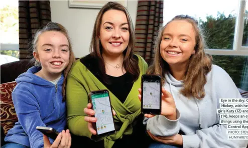  ?? PHOTO: STEVE HUMPHREYS ?? Eye in the sky: Cliona Hickey, with her two girls Katy (12) and Chloe (14), keeps an eye on things using the Kids Control App.