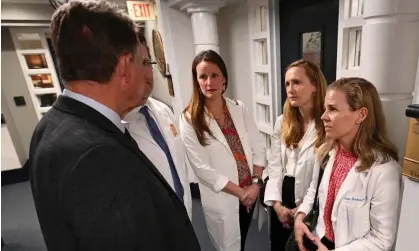  ?? ?? Fertility doctors from Alabama talk to state senator Donnie Chesteen about support for IVF legislatio­n. Photograph: Julie Bennett/Reuters