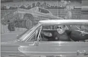  ?? Ray Chavez/bay Area News Group/tns ?? Robert Diaz, vice president of the United Low Riders Council, poses with his lowrider car, a 1964 Chevy Impala Supersport, in front of a low riding mural in San Jose, Calif., on Friday.