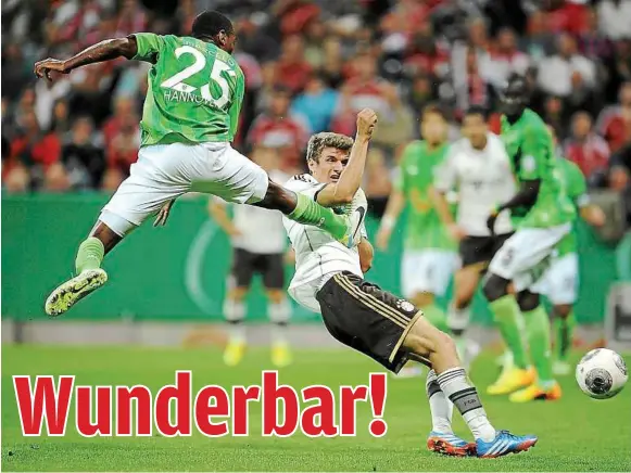  ??  ?? Opening accounts: Thomas Mueller scores the first goal for Bayern Munich against Hanover during their German Cup match on Wednesday. — EPA