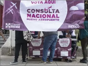  ?? AP PHOTO/CHRISTIAN PALMA ?? People vote on whether to continue with the $13 billion airport to replace the current Benito Juarez Internatio­nal Airport, in Mexico City, on Sunday.