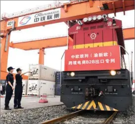  ??  ?? Customs officers inspect a Europe-bound freight train at the Tuanjiecun station in Chongqing municipali­ty on Sept 1.